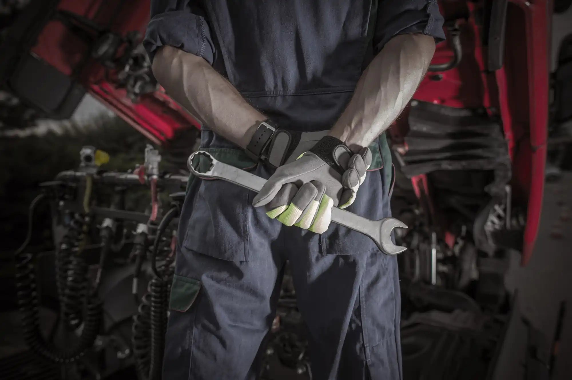 Mechanic holding a wrench.